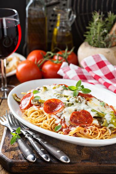 Pasta on table at Italian restaurant with wine